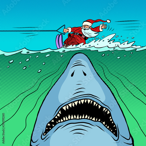 Santa Claus is water skiing. Dangerous shark underwater