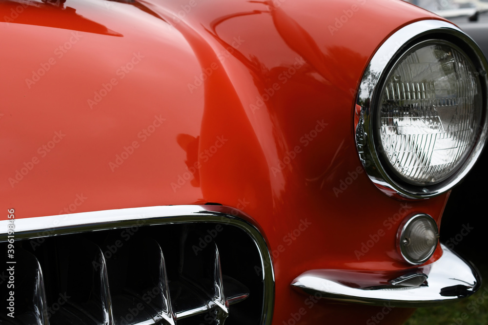 Front end and grill of classic red sports car