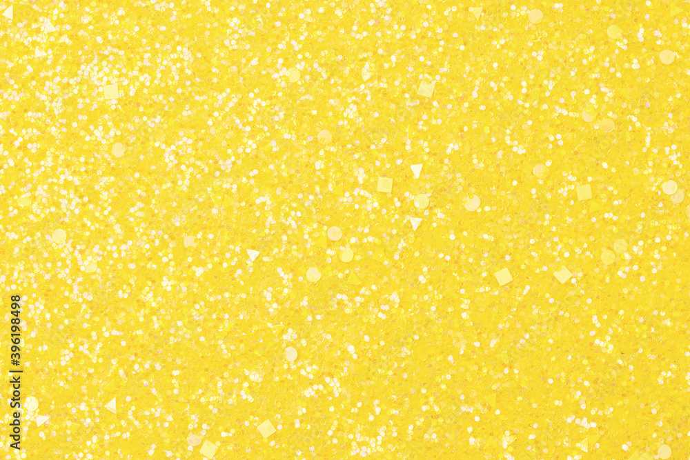 Holographic bright yellow glitter real texture background.