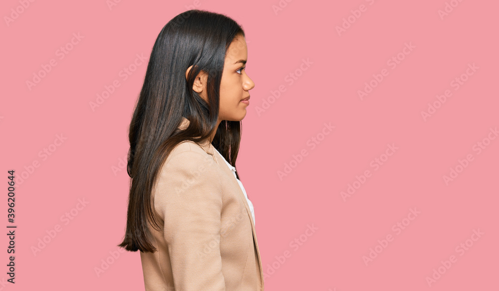 Beautiful hispanic woman wearing business jacket looking to side, relax profile pose with natural face with confident smile. Beautiful hispanic woman wearing business jacket looking to side, relax profile pose with natural face with confident smile.
