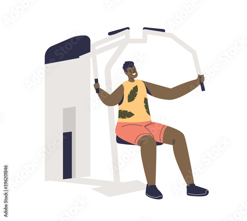 Man exercising on gym sport machines training arm muscles. Young male on trainer apparatus