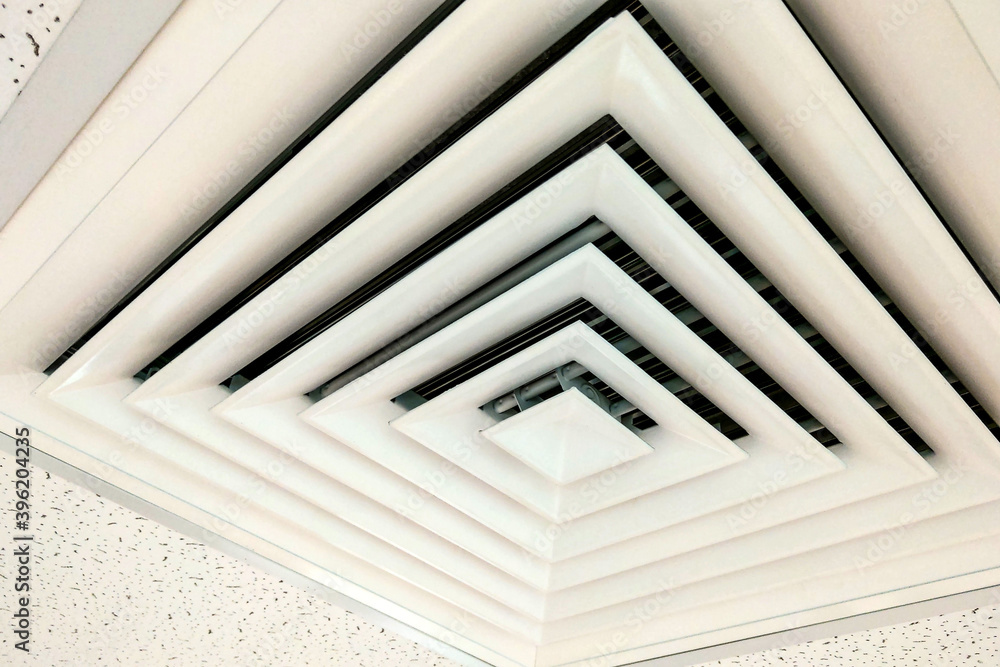 Obraz premium Air Duct Ceiling white, Air duct in square shape, condition vent modern air conditioner or air vent on ceiling white, Duct for conditioning heating on a building ceiling.