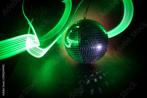 Colorful disco mirror ball lights night club background. Party lights disco ball. Selective focus photo