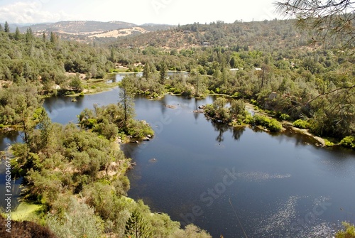 Black Swan Trail managed by Bear Yuba Land Trust near Smartsville, California. On a hydraulic cliff escarpment, hikers will catch spectacular views of the Black Swan Pond. photo