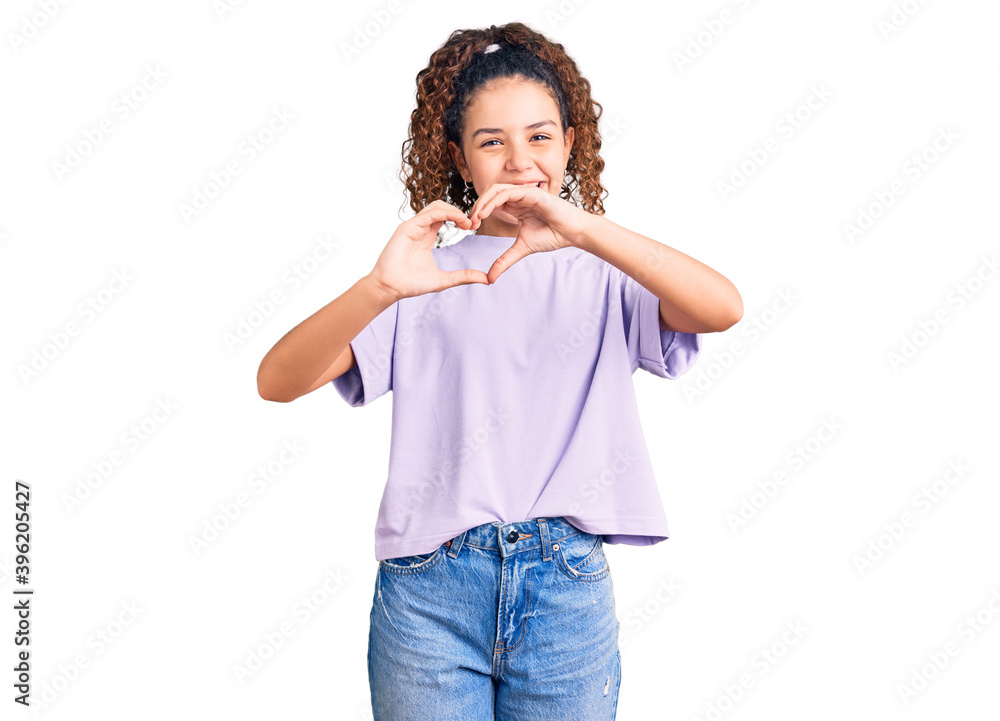 Beautiful kid girl with curly hair wearing casual clothes smiling in love doing heart symbol shape with hands. romantic concept. Beautiful kid girl with curly hair wearing casual clothes smiling in love doing heart symbol shape with hands. romantic concept.