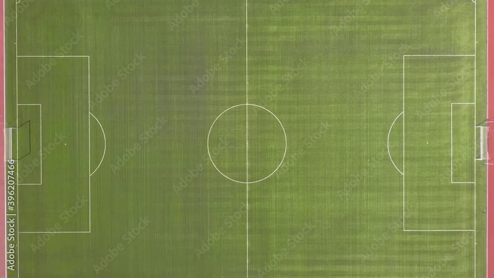 Aerial view of football field. New public soccer stadium outdoors from above. Beautiful soccer playground. Aerial view of football field. New public soccer stadium outdoors from above. Beautiful soccer playground.