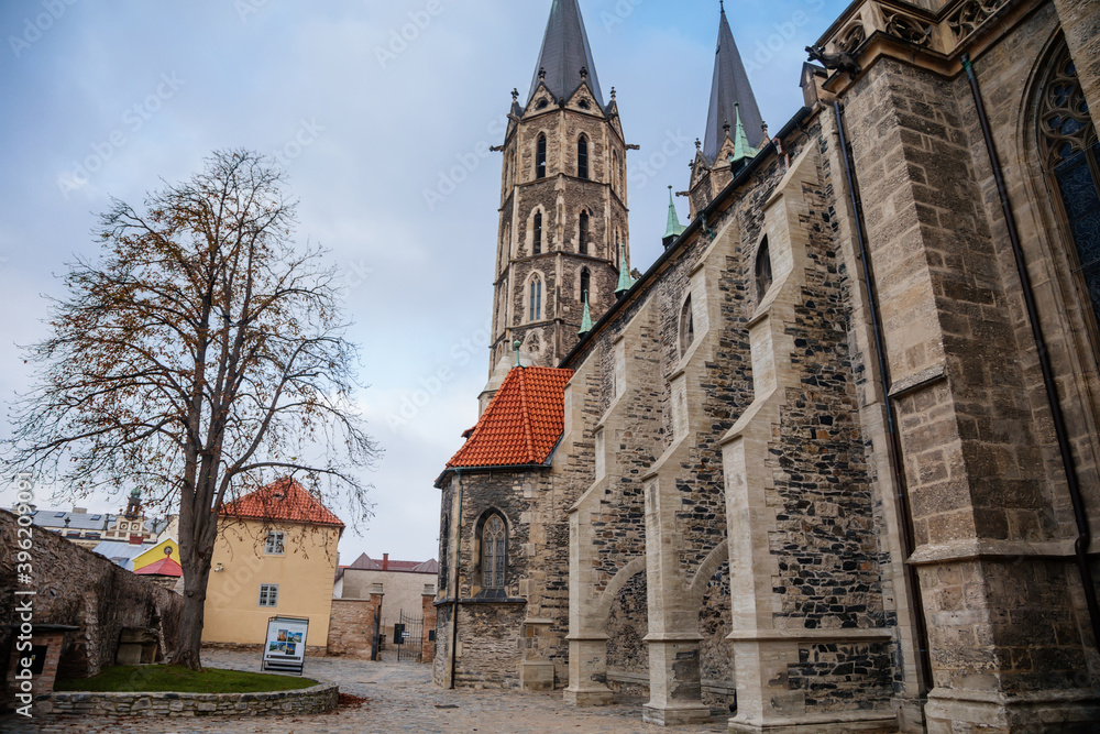 Medieval stone St. Bartholomew´s Church in autumn day, arched windows, chimeras and gargoyles, Gothic Cathedral with belfry in Kolin, Central Bohemia, Czech republic Medieval stone St. Bartholomew´s Church in autumn day, arched windows, chimeras and gargoyles, Gothic Cathedral with belfry in Kolin, Central Bohemia, Czech republic