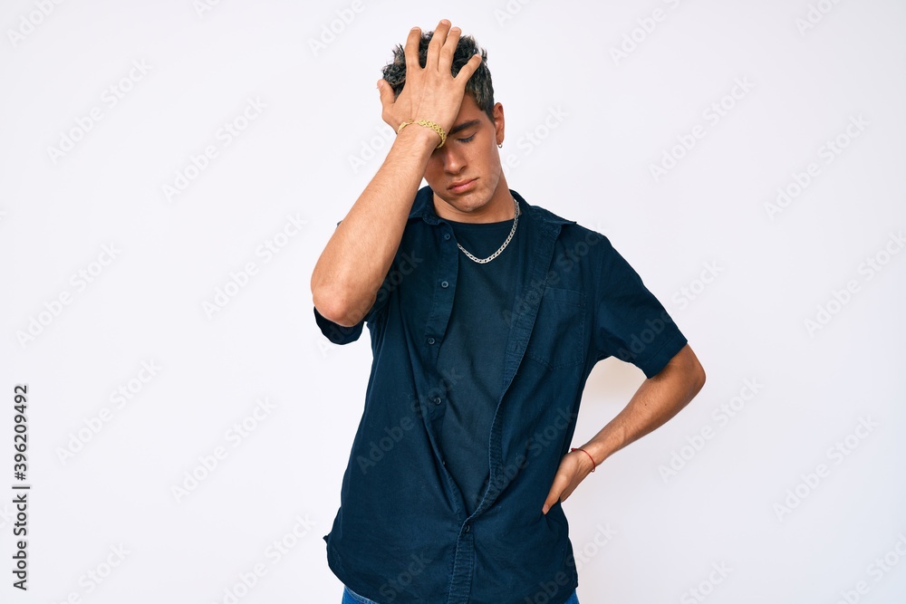 Young handsome man wearing casual clothes surprised with hand on head for mistake, remember error. forgot, bad memory concept. Young handsome man wearing casual clothes surprised with hand on head for mistake, remember error. forgot, bad memory concept.