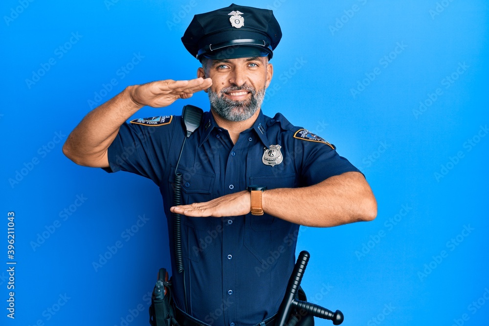 Middle age handsome man wearing police uniform gesturing with hands showing big and large size sign, measure symbol. smiling looking at the camera. measuring concept. Middle age handsome man wearing police uniform gesturing with hands showing big and large size sign, measure symbol. smiling looking at the camera. measuring concept.