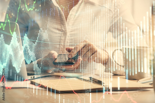 Wallpaper Mural Double exposure of forex chart sketch hologram and woman holding and using a mobile device. Financial market concept. Torontodigital.ca