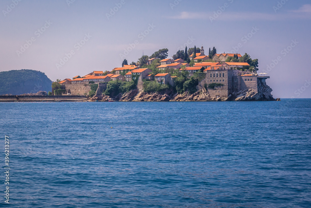 View from a boat on a small Island of Sveti Stefan on the Adriatic Sea in Montenegro