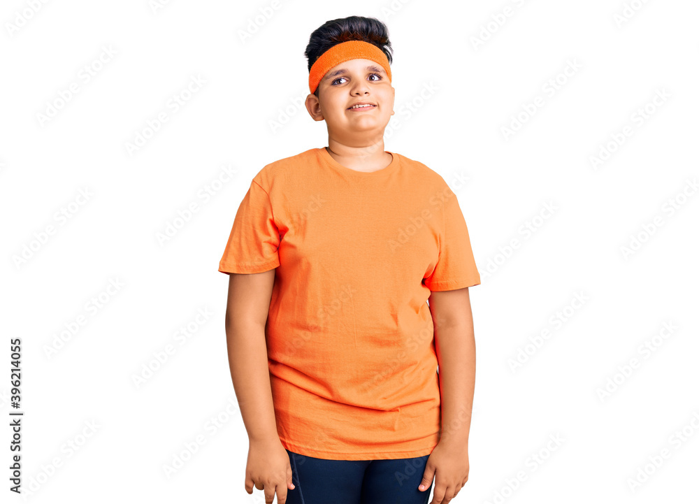 Little boy kid wearing sportswear looking away to side with smile on face, natural expression. laughing confident. Little boy kid wearing sportswear looking away to side with smile on face, natural expression. laughing confident.