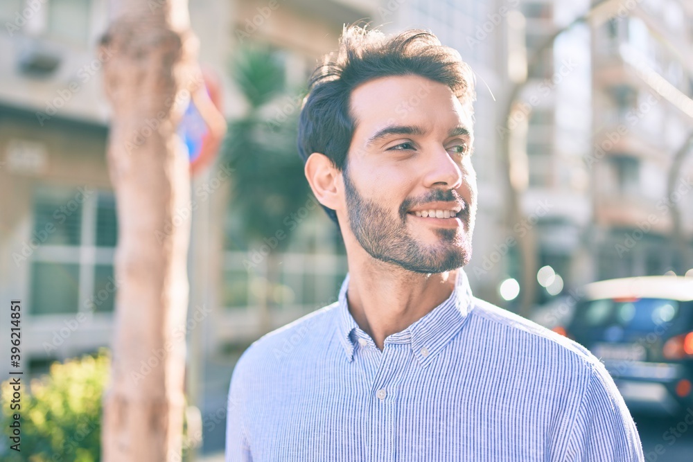 Young hispanic man smiling happy walking at the city. Young hispanic man smiling happy walking at the city.