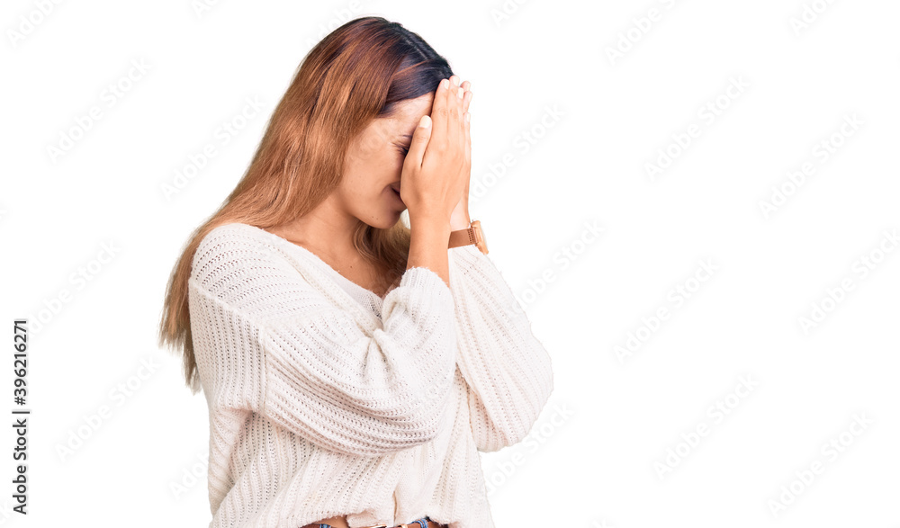 Beautiful young woman wearing casual clothes with sad expression covering face with hands while crying. depression concept. Beautiful young woman wearing casual clothes with sad expression covering face with hands while crying. depression concept.