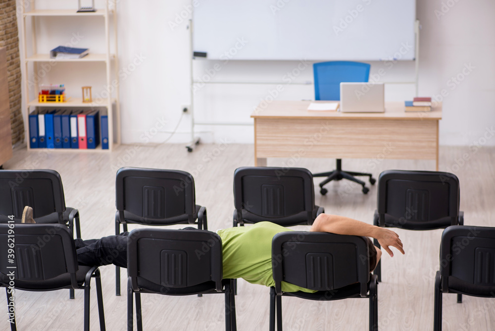 Young male student in business presentation concept Young male student in business presentation concept