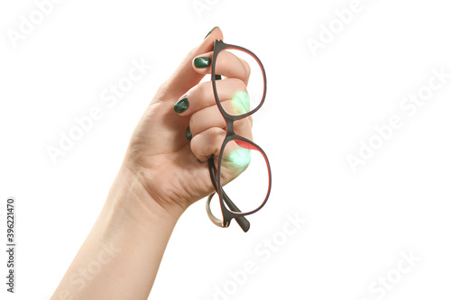 girl with a beautiful mother-of-pearl manicure holds the glasses on a white background