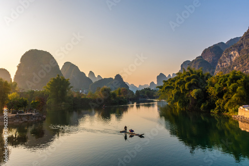 YANGSHUO, CHINA, 6 DECEMBER 2019: Beautiful sunset on the Yulong River in Yangshuo, Guilin, Guangxi