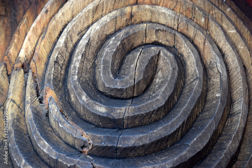 Close up detail of a carved wooden koru pattern photo