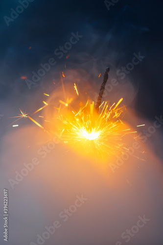 fire sparkler in dense smoke  abstract Christmas firework background