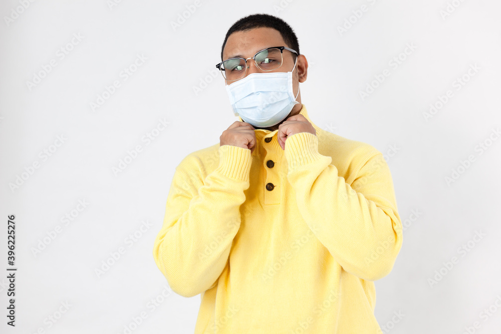 Asian man in a protective mask on white background