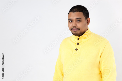 portrait of asia man looking at camera on white background