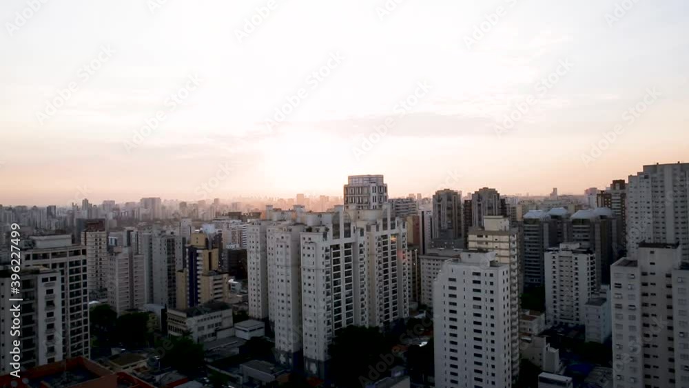 Drone shot of apartment buildings and office high rise, during sunset, in Sao Paulo city, Brazil, South America,- rising, aerial view Drone shot of apartment buildings and office high rise, during sunset, in Sao Paulo city, Brazil, South America,- rising, aerial view