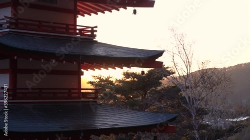 Wallpaper Mural Beautiful silhouette of Pagoda with sun setting in background behind hills Torontodigital.ca