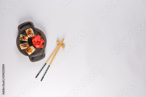 Appetizing rolls on a white background. Japanese food concept. Close-up. Copy space. Flat lay.