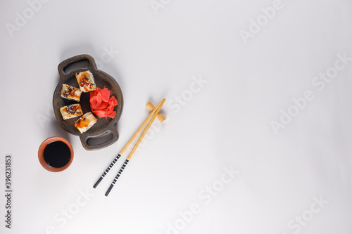 Appetizing rolls on a white background. Japanese food concept. Close-up. Copy space. Flat lay.
