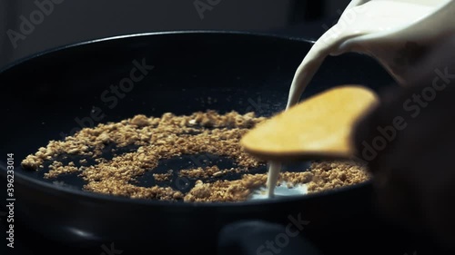 All Purpose Flour fried in a pan - goldy photo