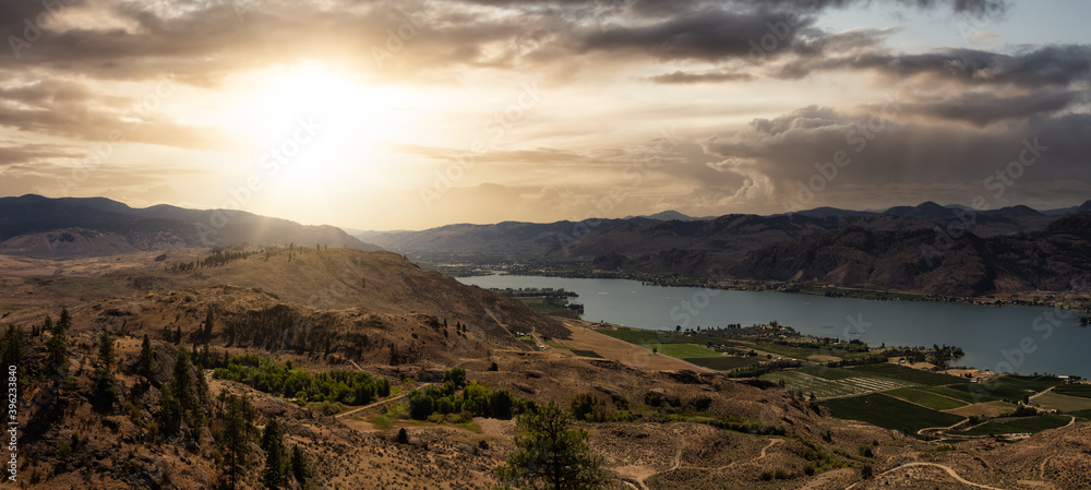 Aerial panoramic landscape view of Osoyoos Lake. Dramatic Colorful Sunset Sky. Located in the Interior of BC, Canada.