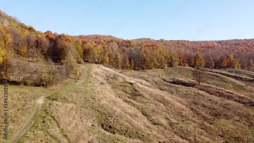 Aerial view of hills on autumn season. Fall colors of a forest in Autumn Season Aerial view of hills on autumn season. Fall colors of a forest in Autumn Season