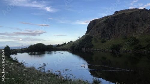 Dunsapie Loch in Edinburgh on a gorgeous sunny day and blue sky in the Holyrood park photo