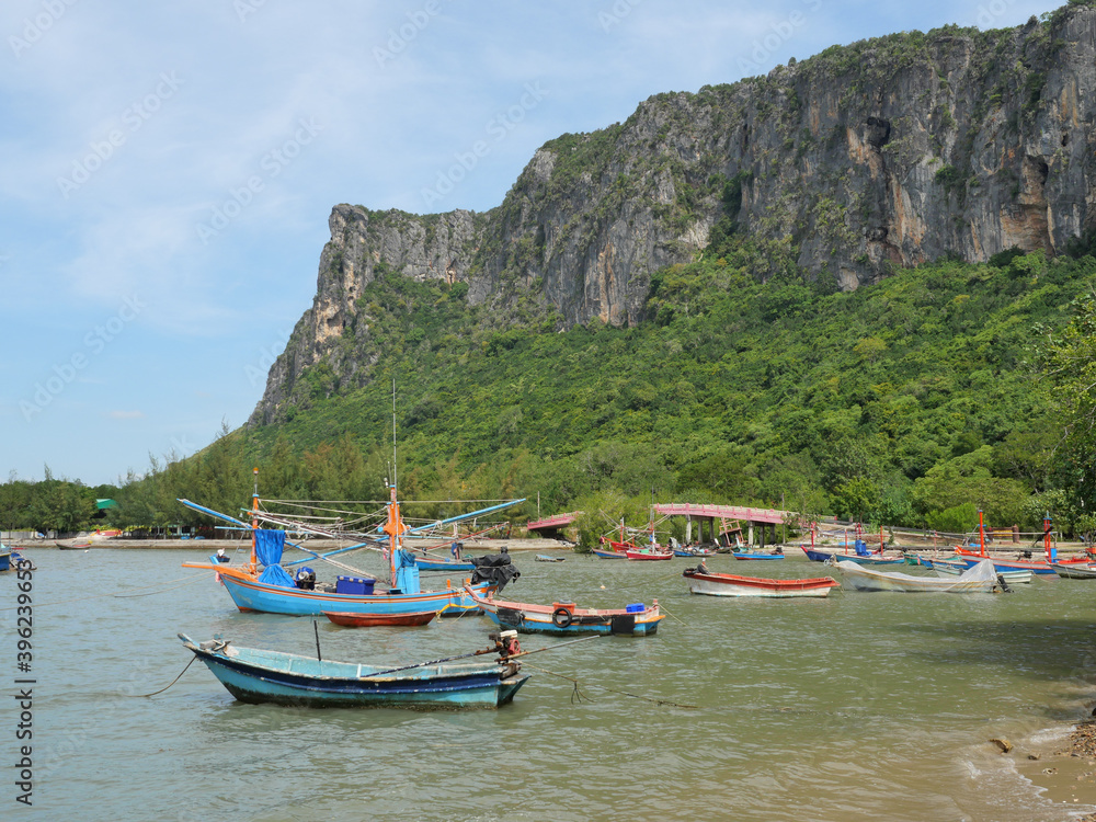 Trawler and Fishing boat at sea with mountain with bridge and the island at Prachuap Bay, Prachuap Khiri Khan, Thailand