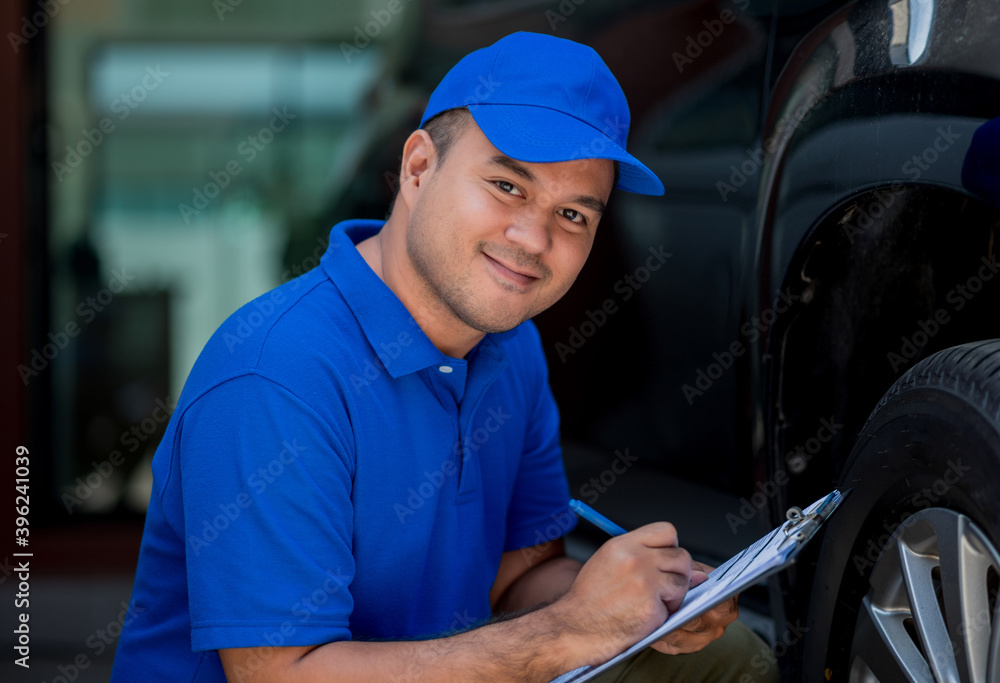 A car maintenance worker is checking the quality of the tires that are worn out, should they be replaced or not He takes care of the car for the customer. A car maintenance worker is checking the quality of the tires that are worn out, should they be replaced or not He takes care of the car for the customer.