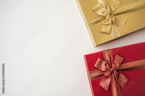 Gift box mockup on the white table with copy space. Merry christmas and happy new years background for text advertise.