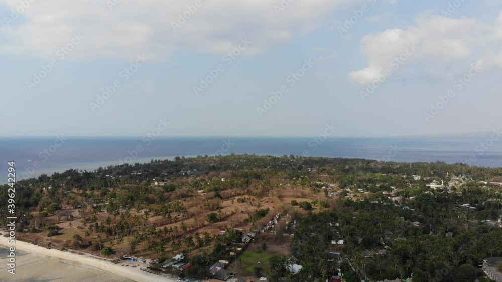 Drone shot of Gili Air island, Indonesia, on a hot, sunny day. Drone shot of Gili Air island, Indonesia, on a hot, sunny day.