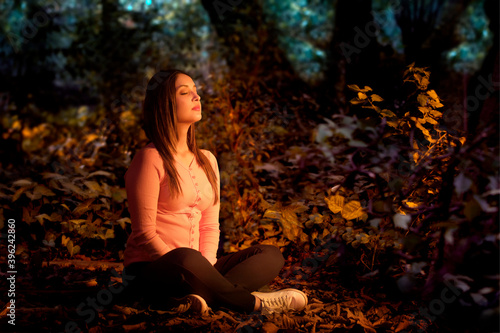 Woman meditating in the morning	 photo