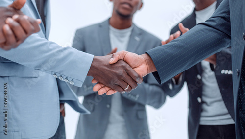 Wallpaper Mural young business partners shaking hands to applause of employees Torontodigital.ca