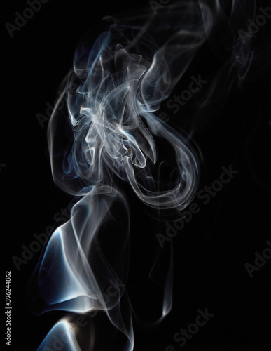 White natural steam smoke effect on solid black background with abstract blur motion wave swirl use for overlay in pollution, vapor cigarette, gas, dry ice, warm hot food, boil water smoke concepts