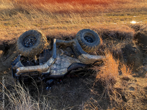 A flipped over ATV
