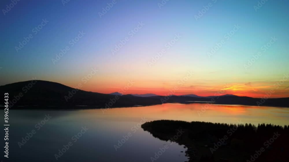 Aerial video of beautiful mountain lake on a frosty autumn morning.