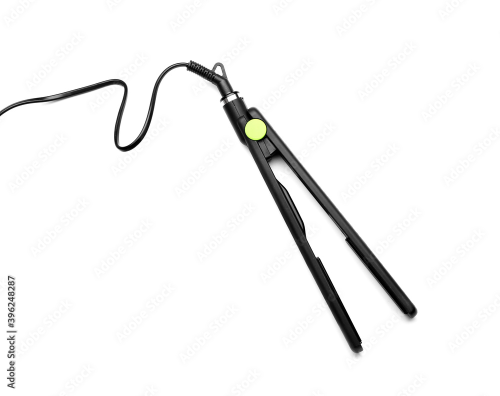 Straightening iron on white background Straightening iron on white background