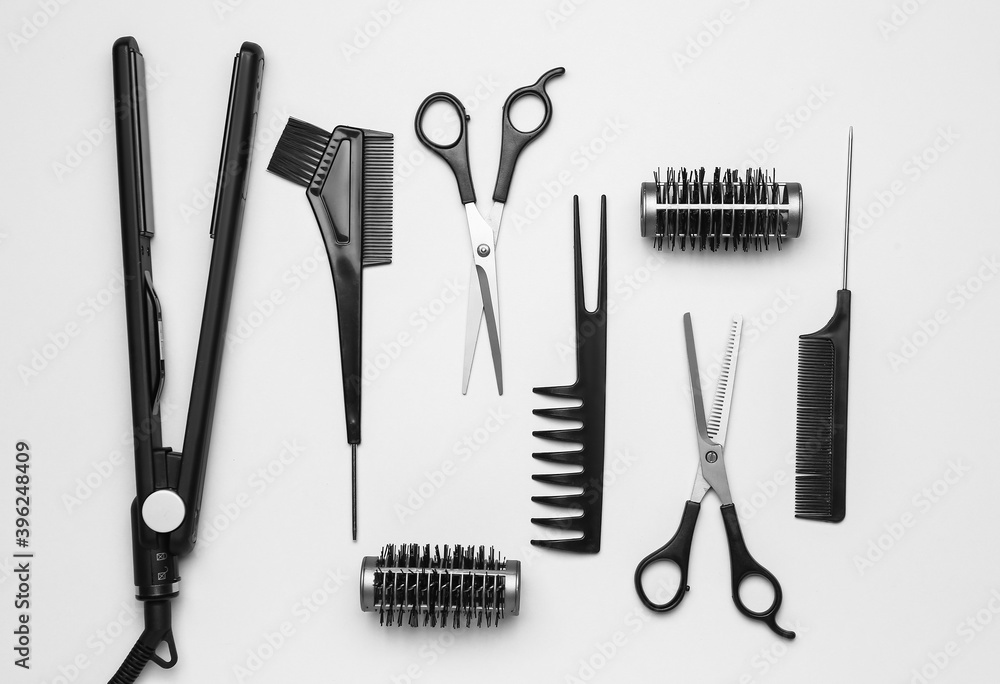 Set of hairdresser's tools on grey background Set of hairdresser's tools on grey background
