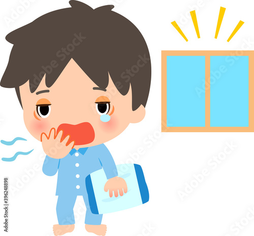 起床後寝ぼけた様子のパジャマ姿の男性
