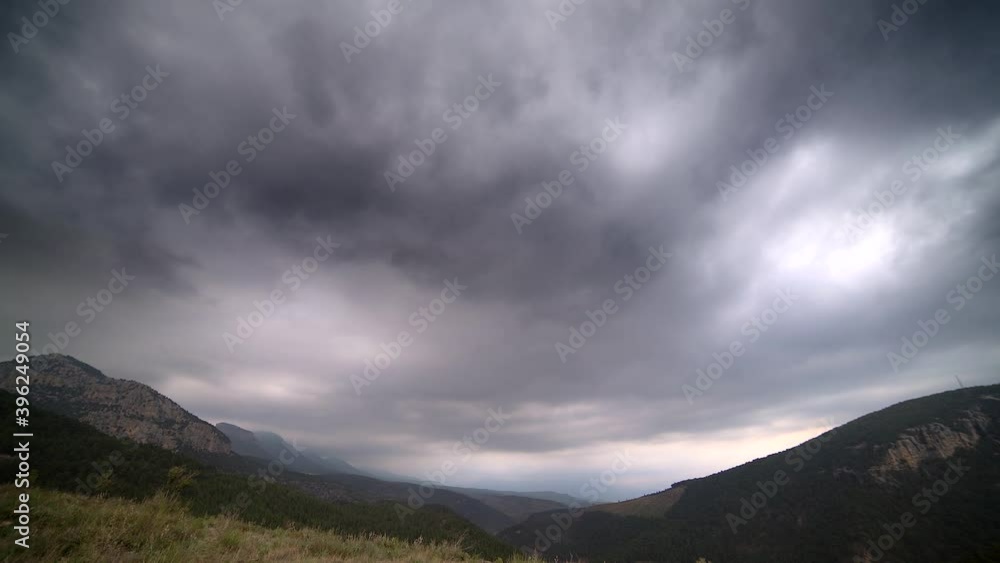 Rain clouds in the forest valley. Approaching Rains. Weather sky atmosphere nimbus overcast storm stormy dark gray depressing gloomy. Rain clouds in the forest valley. Approaching Rains. Weather sky atmosphere nimbus overcast storm stormy dark gray depressing gloomy.