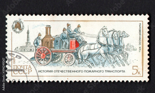 Stamp dedicated to historic fire engine. History of fire fighting equipment