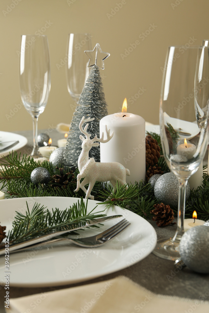 Fototapeta premium Concept of romantic New year table setting on gray table