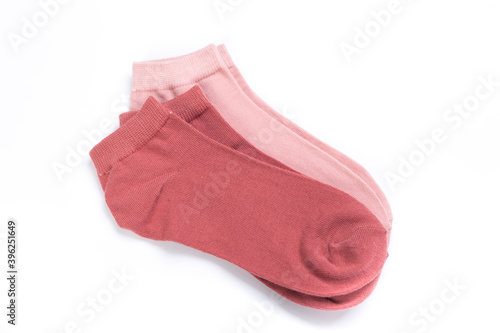 two pairs of colored short socks on a white background, top view