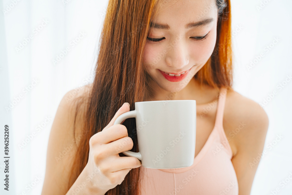 Close up portrait of asian woman holding a cup of coffee isolate on white background. Close up portrait of asian woman holding a cup of coffee isolate on white background.